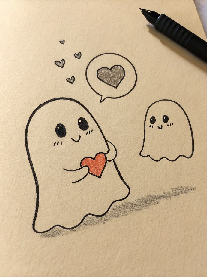 Desenho fofo de fantasminhas segurando coração